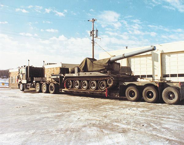 A tank on a double-drop trailer, E. L. Murphy Trucking.